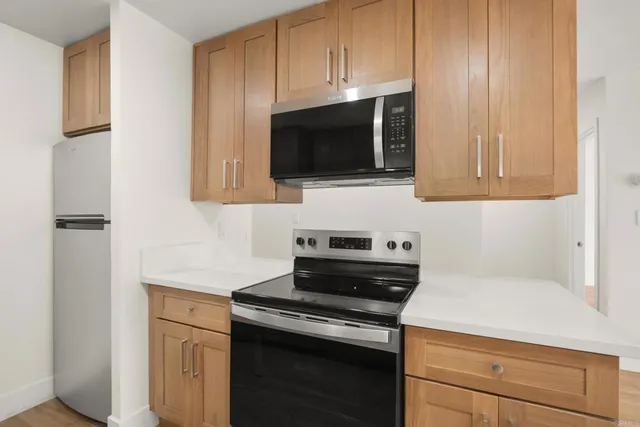 a kitchen with a stove and a microwave