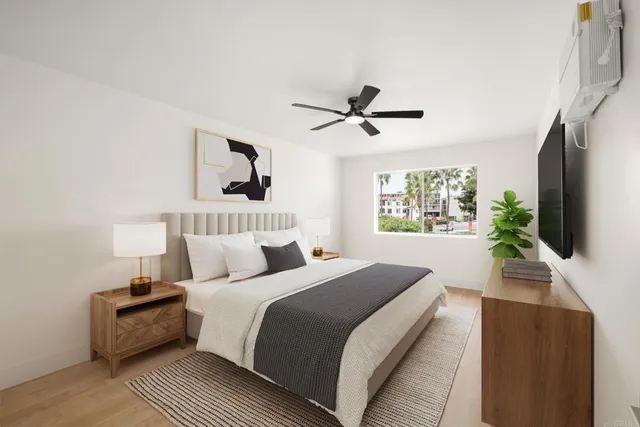 a bedroom with a large bed and a flat screen tv