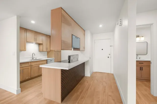 a kitchen with a sink stove and refrigerator
