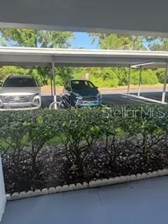a view of a couple of cars parked in parking area