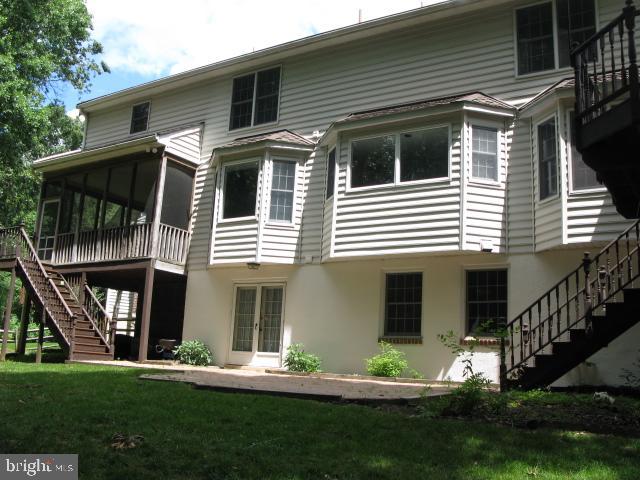 9719 Deep Smoke Columbia, MD 21046 - Photo 3 of 31 Rear of House with screened porch