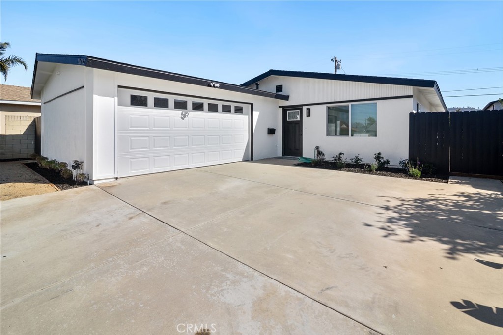 11452 Earlham Street Orange, CA 92869 - Photo 1 of 30 a front view of a house with a yard
