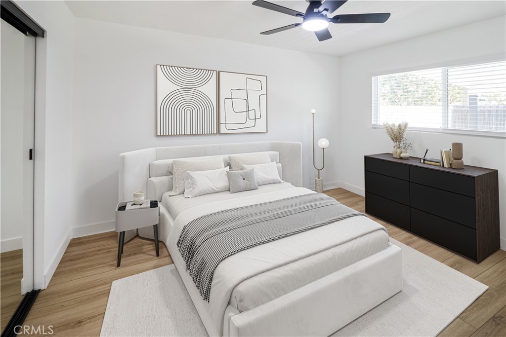 11452 Earlham Street Orange, CA 92869 - Photo 13 of 30 a bedroom with a bed and window