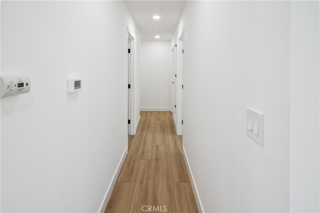 11452 Earlham Street Orange, CA 92869 - Photo 18 of 30 a view of a hallway with wooden floor