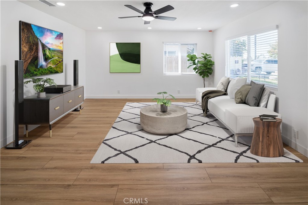 11452 Earlham Street Orange, CA 92869 - Photo 6 of 30 a living room with furniture and a flat screen tv