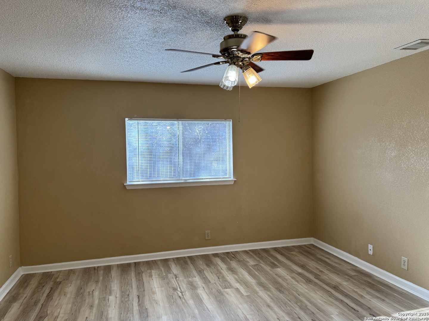 7315 Northallerton Converse, TX 78109 - Photo 11 of 22 a view of room with a ceiling fan