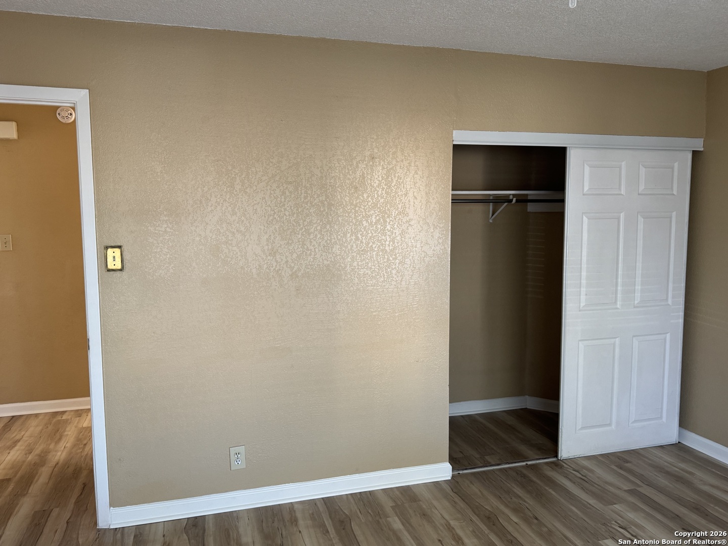 7315 Northallerton Converse, TX 78109 - Photo 16 of 22 an empty room with wooden floor and closet