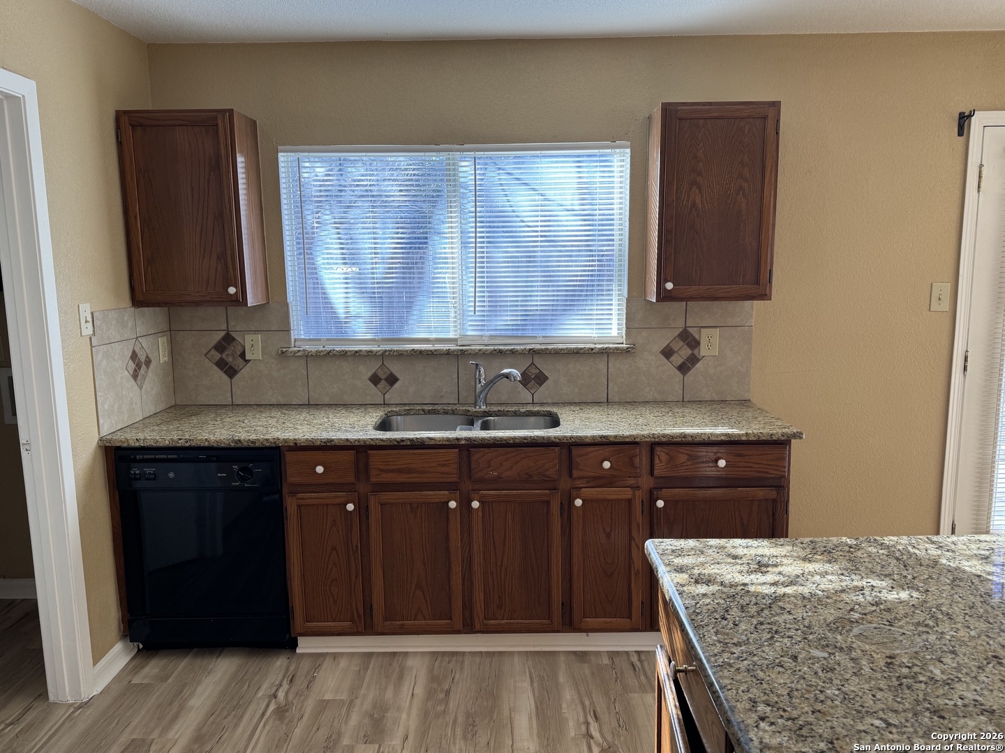7315 Northallerton Converse, TX 78109 - Photo 9 of 22 a kitchen with a sink stove and cabinets