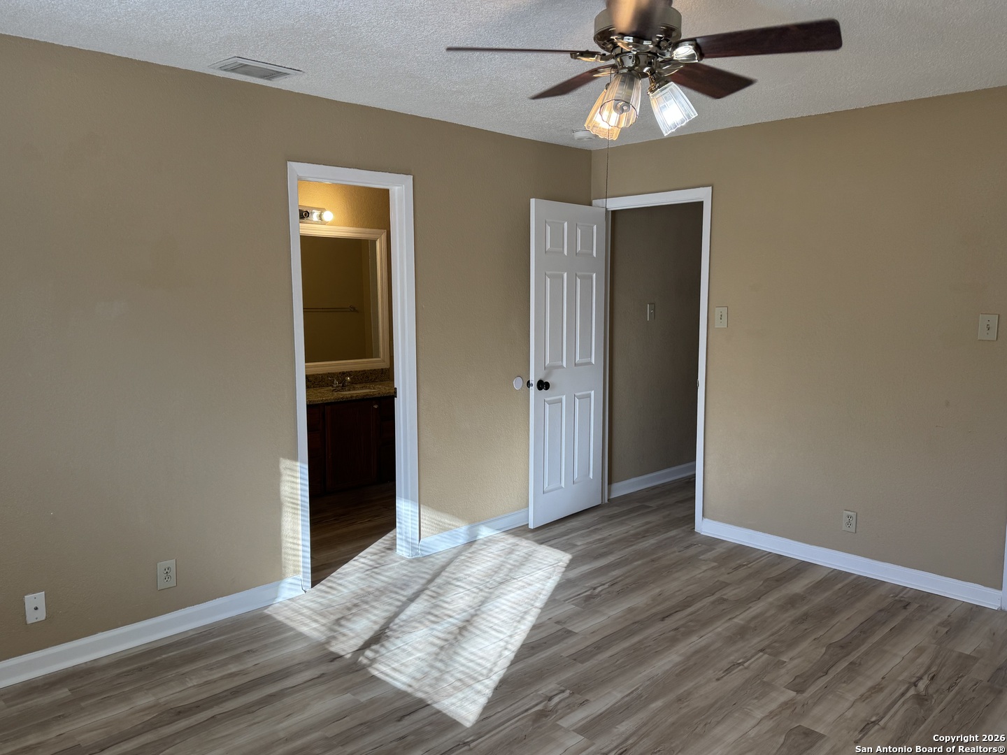 7315 Northallerton Converse, TX 78109 - Photo 10 of 22 a view of an empty room with window and wooden floor