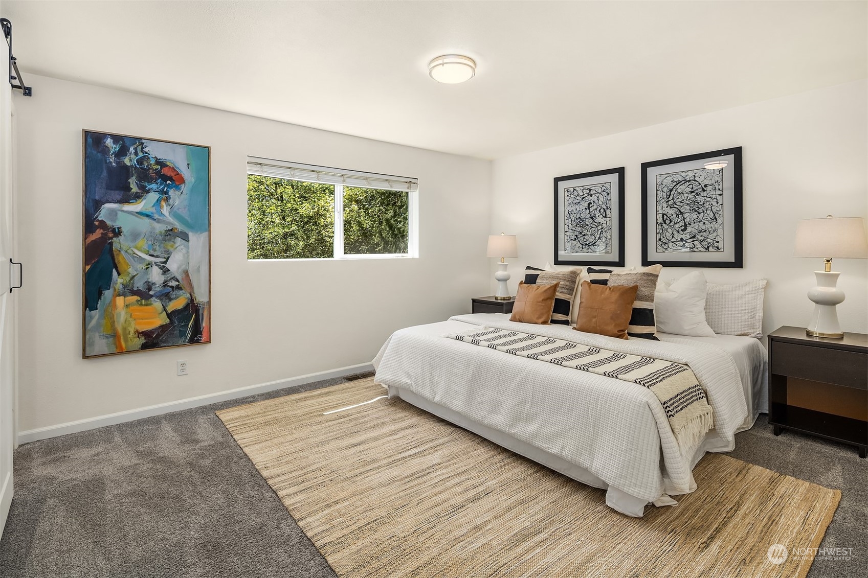 20211 Southeast 157th Street Renton, WA 98059 - Photo 12 of 38 a bedroom with bed and wall painting with wooden floor