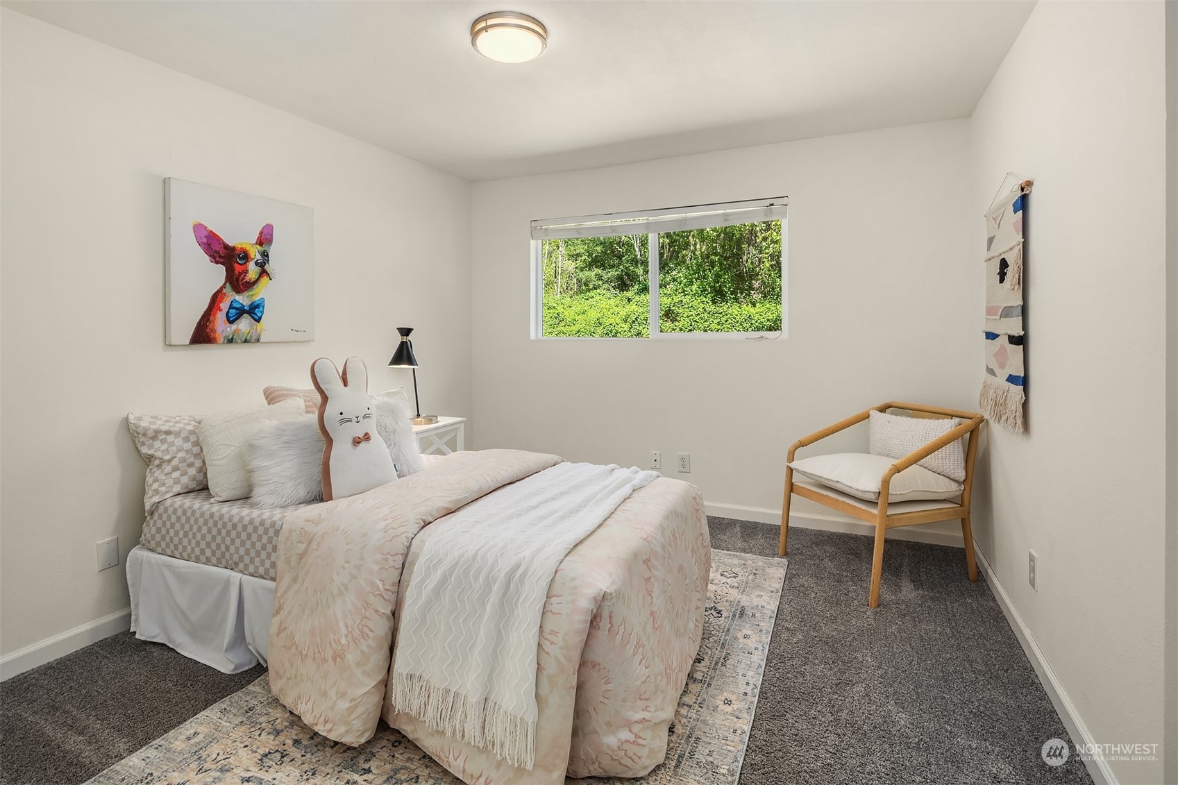 20211 Southeast 157th Street Renton, WA 98059 - Photo 15 of 38 a bedroom with a bed and a chair