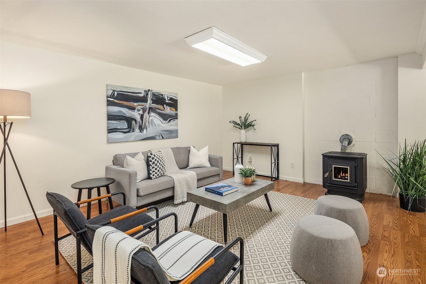 20211 Southeast 157th Street Renton, WA 98059 - Photo 20 of 38 a living room with furniture and a fireplace