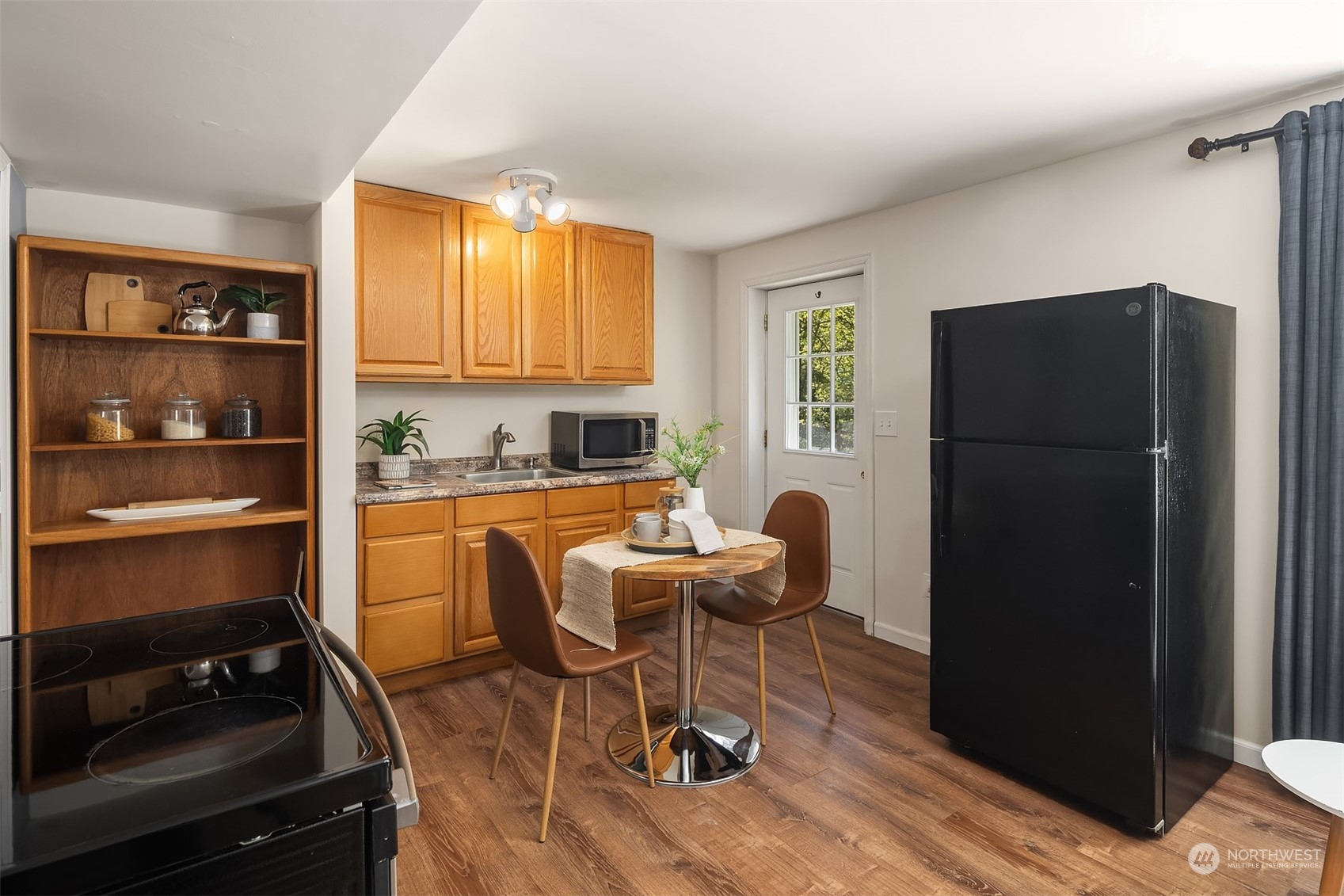20211 Southeast 157th Street Renton, WA 98059 - Photo 25 of 38 a dining room with furniture and a window