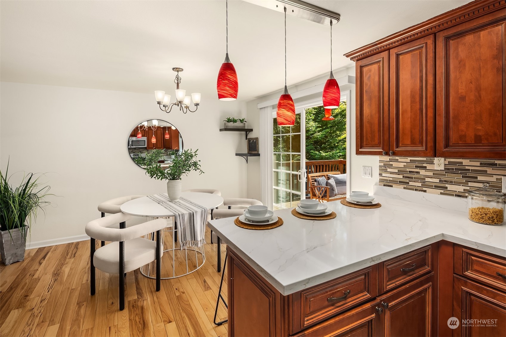 20211 Southeast 157th Street Renton, WA 98059 - Photo 9 of 38 a view of a dining room with furniture and chandelier
