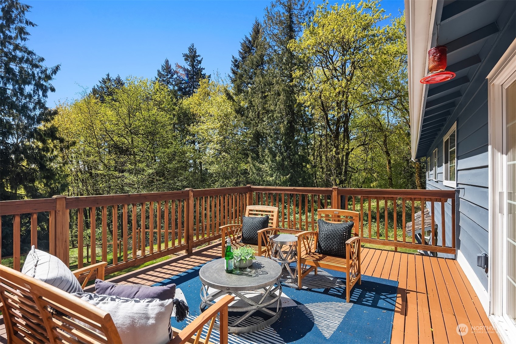 20211 Southeast 157th Street Renton, WA 98059 - Photo 10 of 38 a balcony with wooden floor and furniture