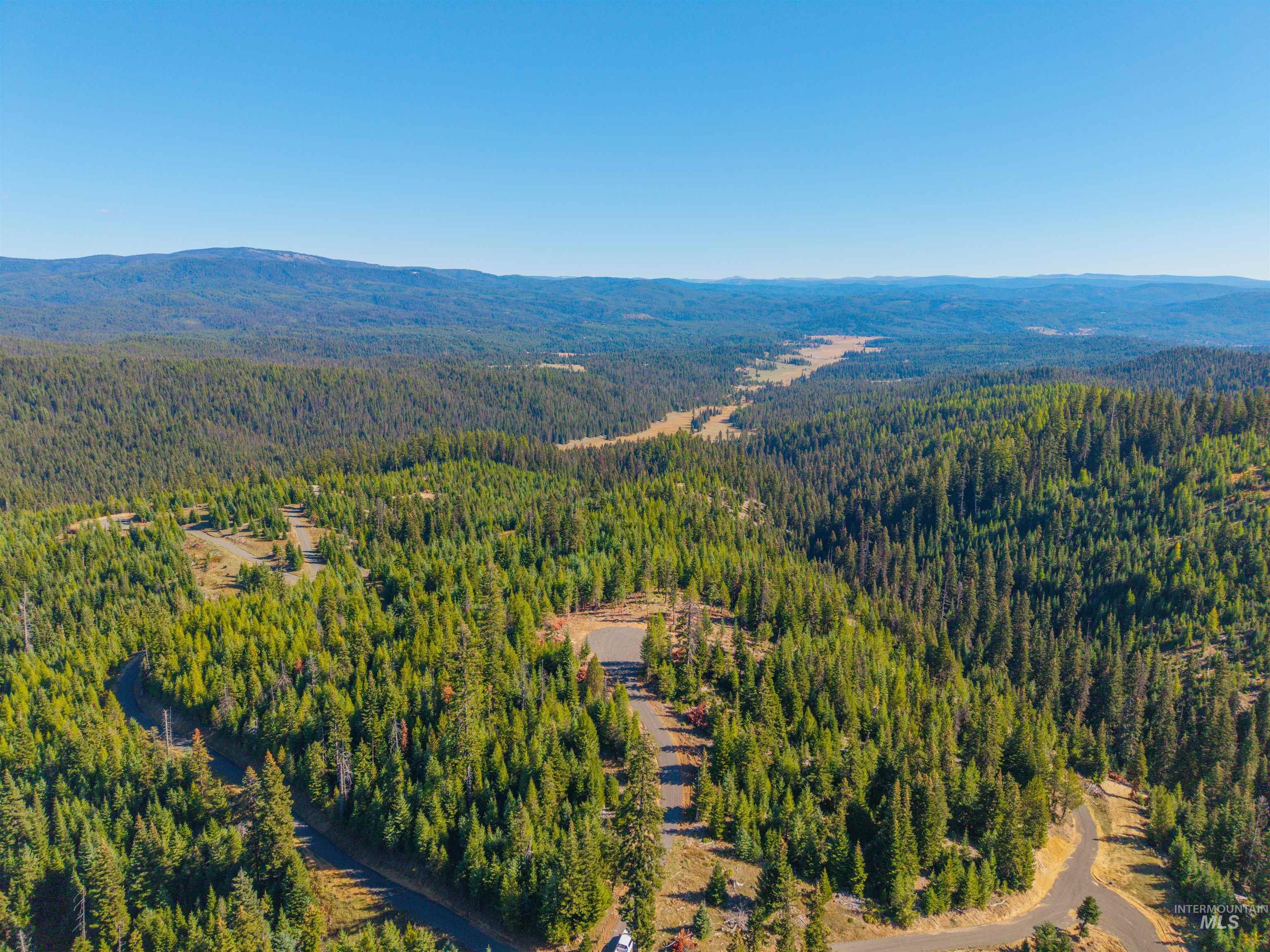 6 Tree Farm Trails Road Elk City, ID 83525 - Photo 12 of 13 Aerial view of a heavily wooded area and mountains