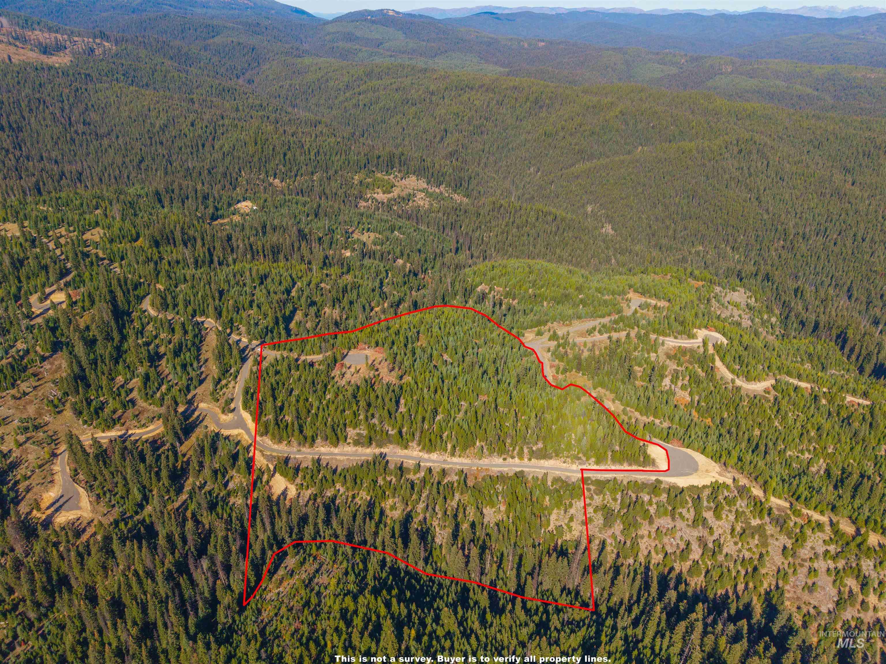 6 Tree Farm Trails Road Elk City, ID 83525 - Photo 10 of 13 Aerial overview of property's location featuring a mountain backdrop and property parcel outlined