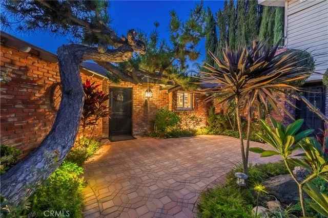 a view of a house with a tree
