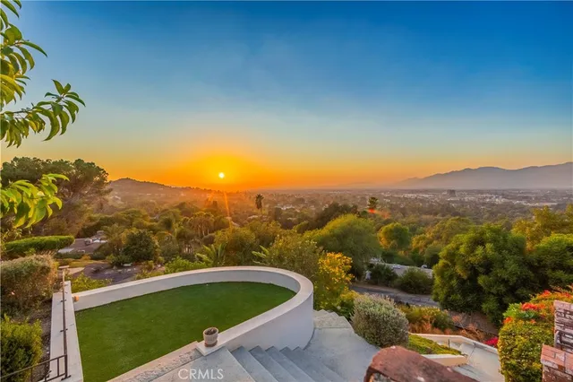 a view of a swimming pool with an outdoor seating