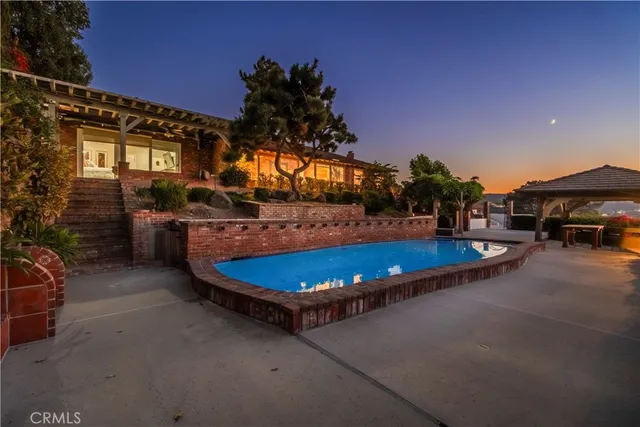 a view of a backyard with sitting area