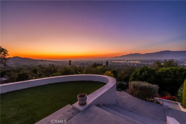 a terrace with outdoor seating and city view