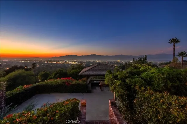 a view of a street with a garden