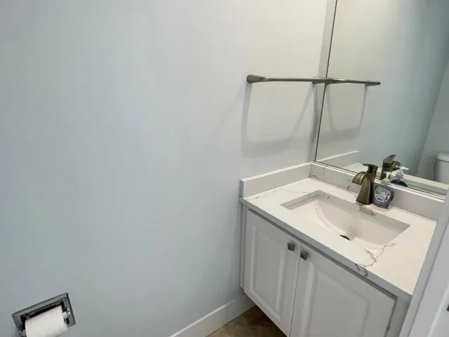 a bathroom with a sink and mirror