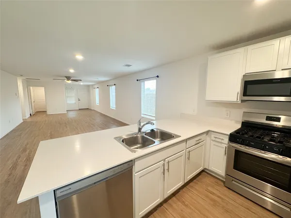 a kitchen with a sink and cabinets