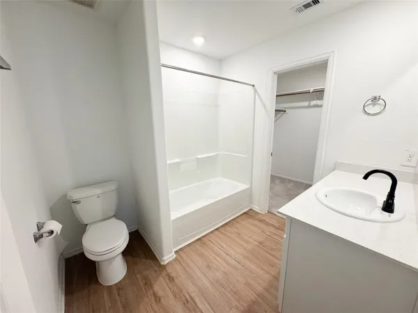 a bathroom with a toilet sink and a shower