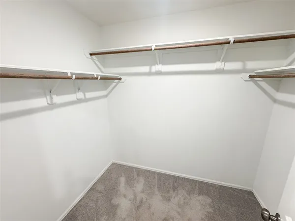 a view of an empty walk in closet