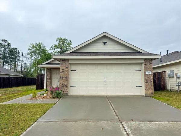 a front view of house with garage