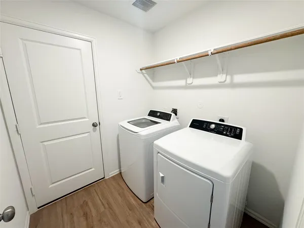 a utility room with dryer and washer