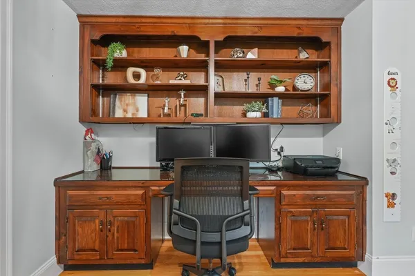 a kitchen with granite countertop a stove and cabinets