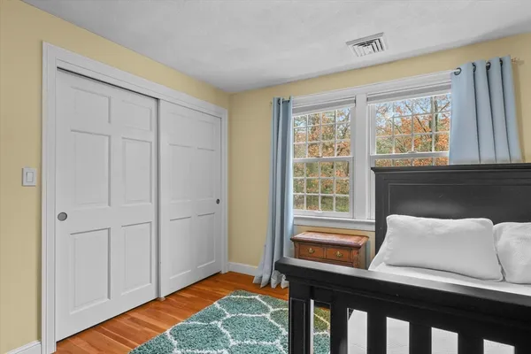 a bedroom with furniture and a window
