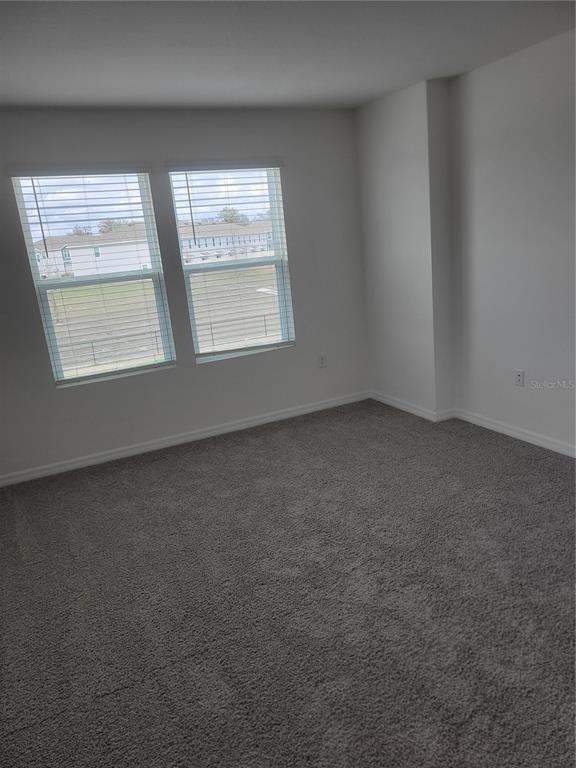 6534 Southwest 82nd Loop Ocala, FL 34476 - Photo 11 of 13 an empty room with a window