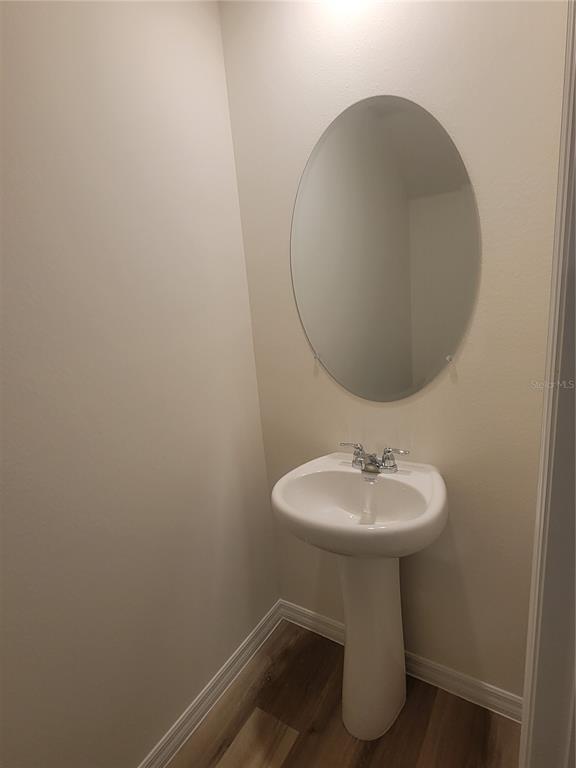 6534 Southwest 82nd Loop Ocala, FL 34476 - Photo 7 of 13 a bathroom with a sink toilet and a mirror