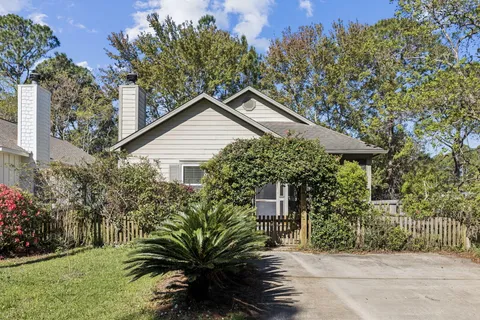 a house with a tree in front of it