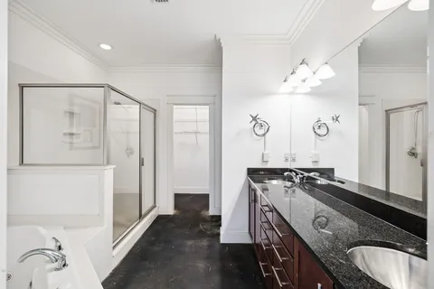 a bathroom with a shower and a tub