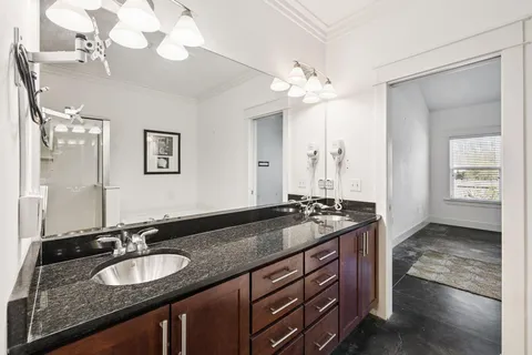 a bathroom with a shower and a sink