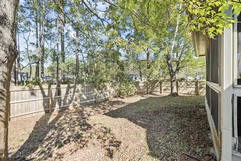 a backyard of a house with lots of green space