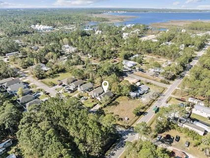 an aerial view of a house with yard