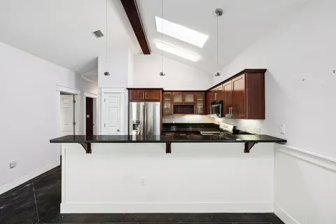 a hallway with a table and couch