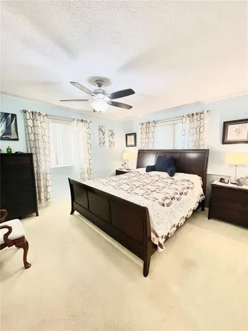 a bedroom with a bed and a couch