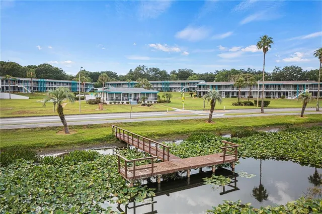 a view of a swimming pool and a yard