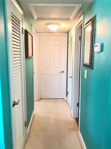a view of a bathroom with shower and windows