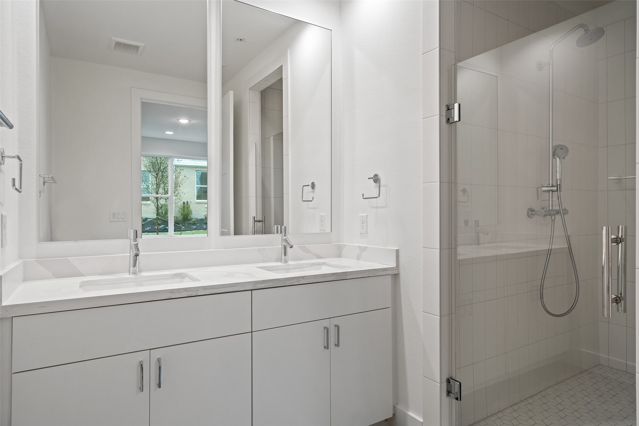 2805 McCurdy Street, Unit 6 Austin, TX 78723 - Photo 27 of 38 a bathroom with a shower sink vanity granite and mirror
