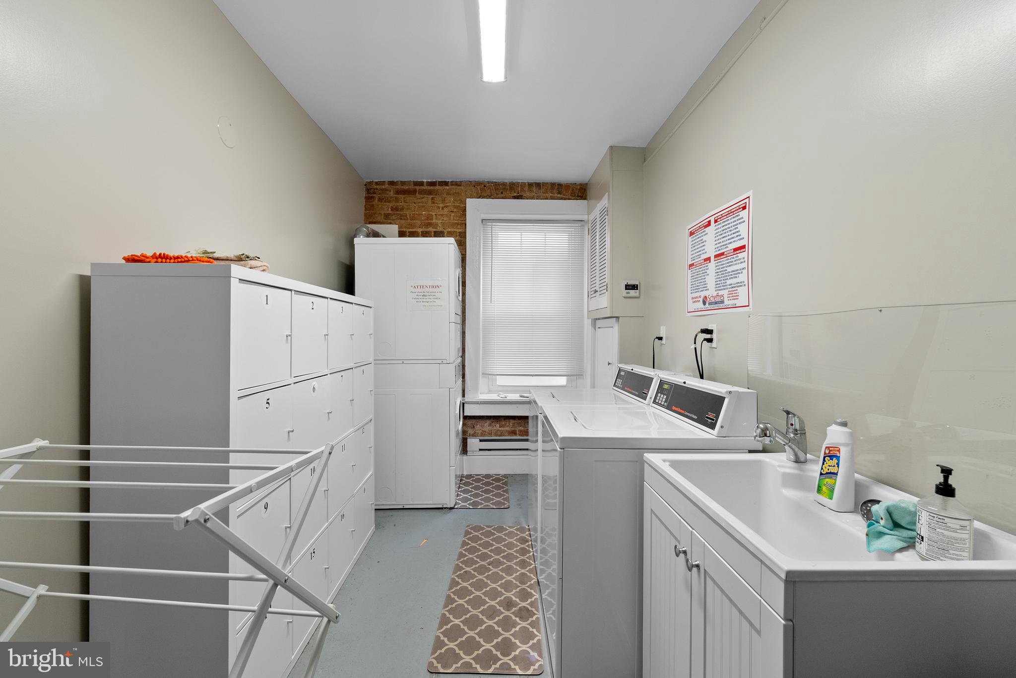 115 2nd Street Northeast, Unit 16 Washington, DC 20002 - Photo 19 of 21 a utility room with sink dryer and washer