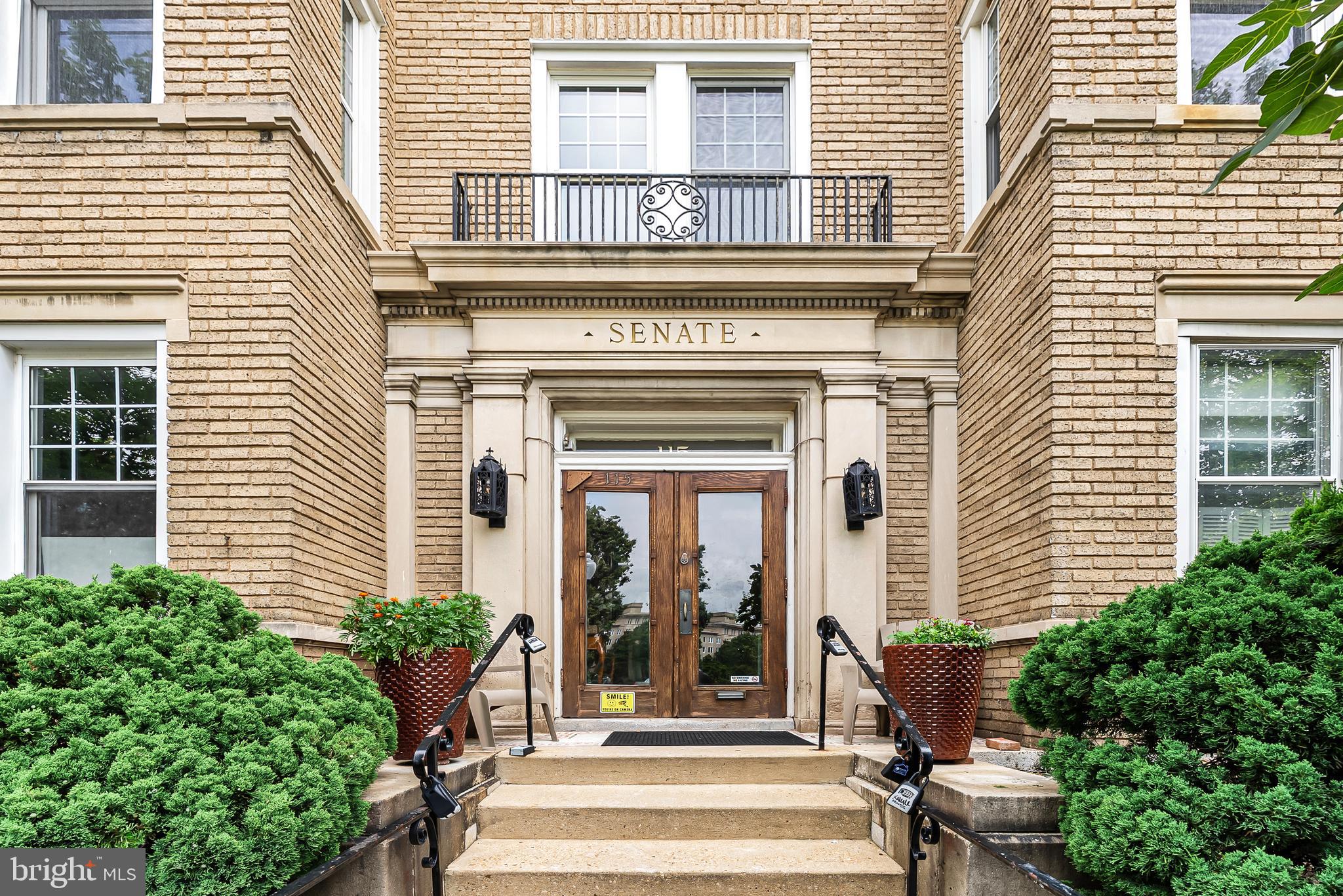 115 2nd Street Northeast, Unit 16 Washington, DC 20002 - Photo 2 of 21 a front view of a house with a porch