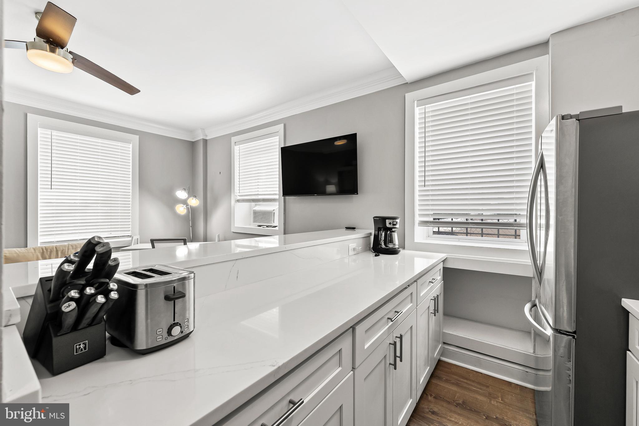115 2nd Street Northeast, Unit 16 Washington, DC 20002 - Photo 5 of 21 a kitchen with a sink stove and microwave