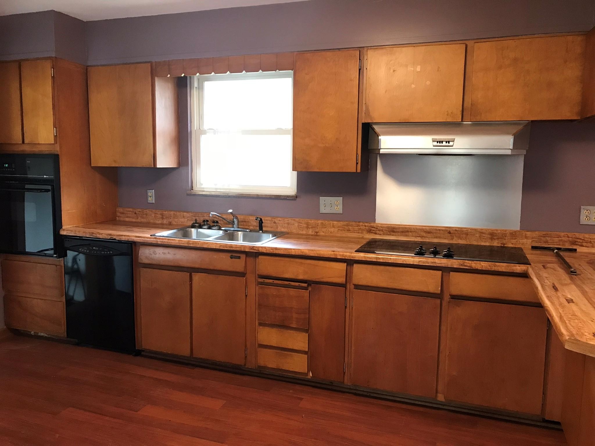 150 North Seneca Road Oak Ridge, TN 37830 - Photo 5 of 23 a kitchen with a sink cabinets and wooden floor